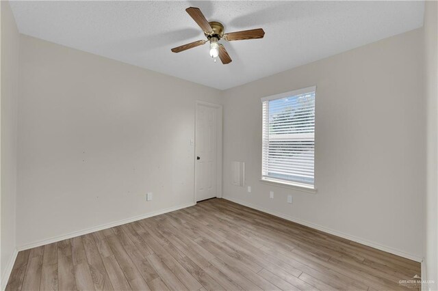 5801 N 36th St, Mcallen, TX 78504 - unfurnished room featuring light wood-type flooring, a ceiling fan, baseboards, and a textured ceiling