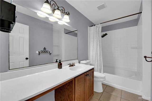 5801 N 36th St, Mcallen, TX 78504 - full bath featuring toilet, vanity, tile patterned floors, and shower / bath combo with shower curtain