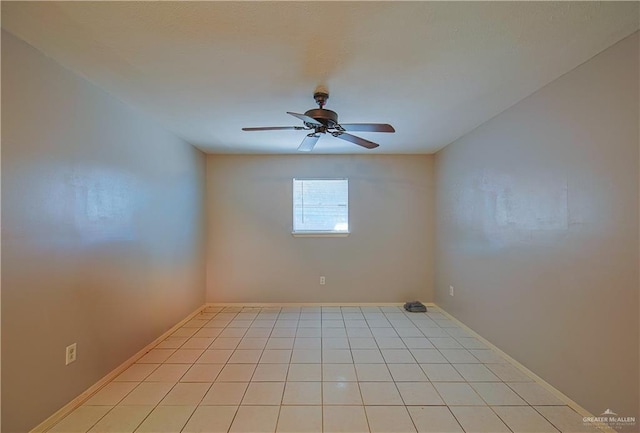 tiled empty room with ceiling fan