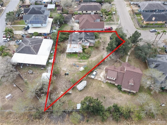 birds eye view of property with a residential view