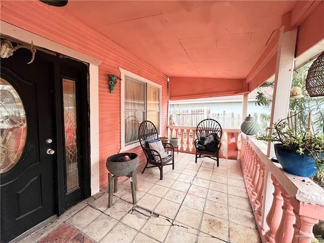 view of patio featuring a porch