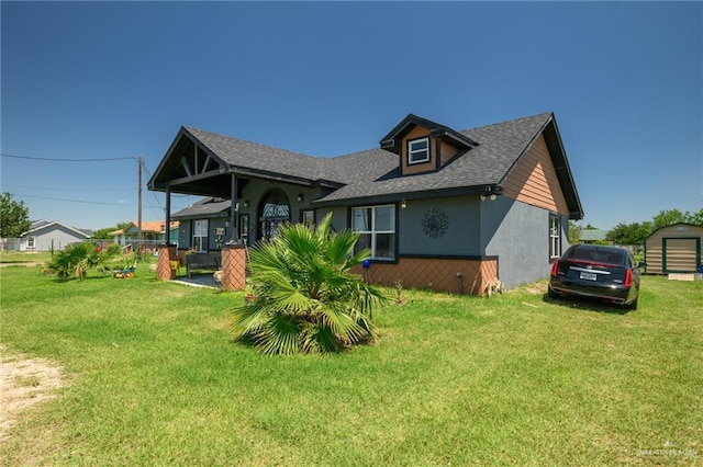 4511 Abbey St, Mercedes, TX 78570 - back of property with a lawn, stucco siding, and roof with shingles