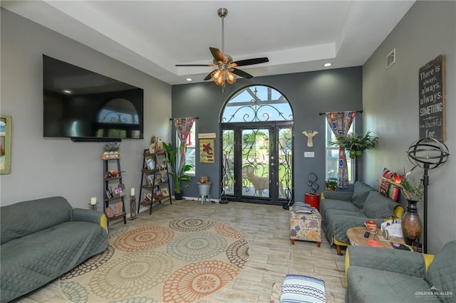4511 Abbey St, Mercedes, TX 78570 - living area featuring a ceiling fan, a tray ceiling, wood finished floors, and recessed lighting