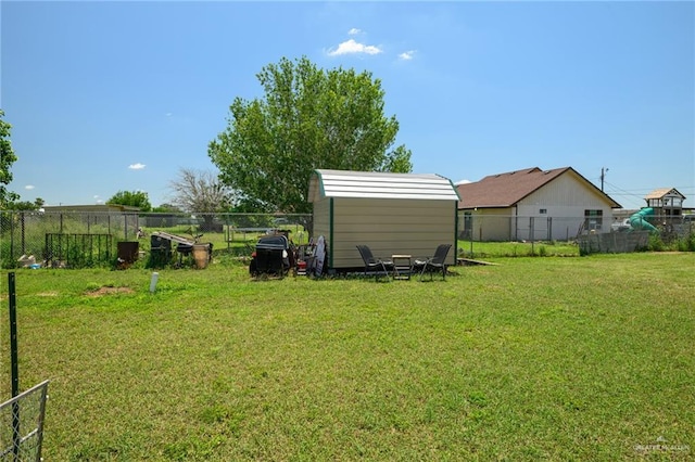 4511 Abbey St, Mercedes, TX 78570 - view of yard featuring an outbuilding and a storage unit