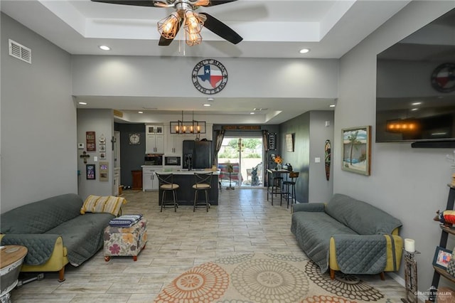 4511 Abbey St, Mercedes, TX 78570 - living room featuring a ceiling fan, recessed lighting, and a tray ceiling