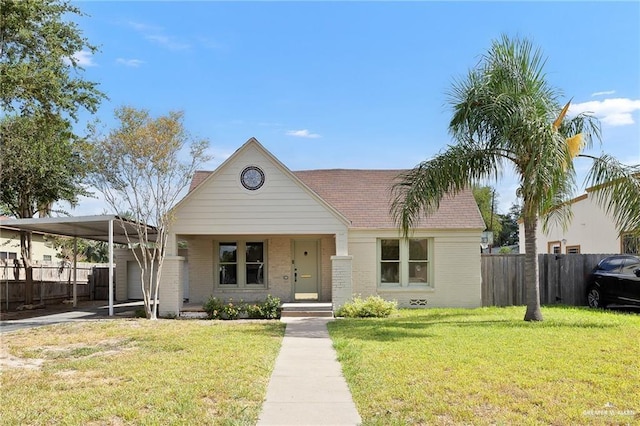 view of front facade featuring a carport and a front yard