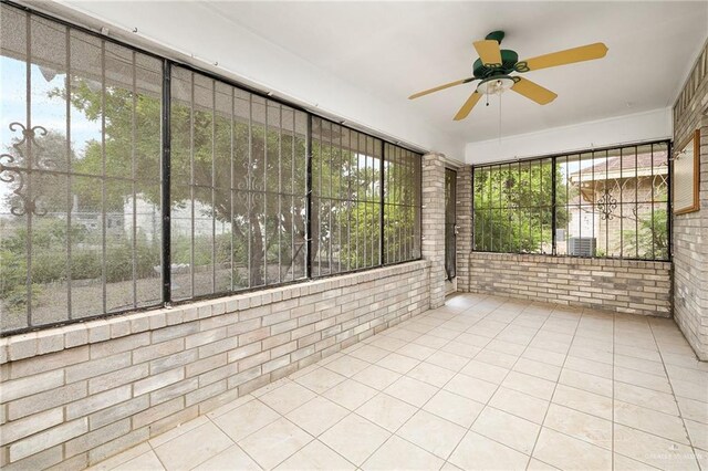 1711 Sun St, Mission, TX 78572 - unfurnished sunroom with ceiling fan