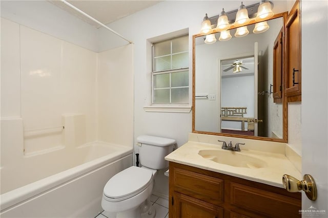 1711 Sun St, Mission, TX 78572 - bathroom with toilet, vanity, washtub / shower combination, and ceiling fan