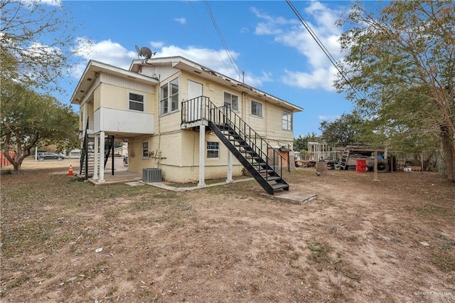 back of property with central air condition unit