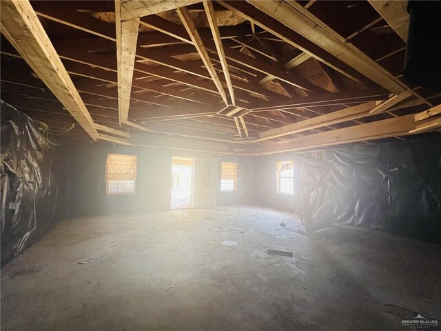 unfinished attic featuring plenty of natural light