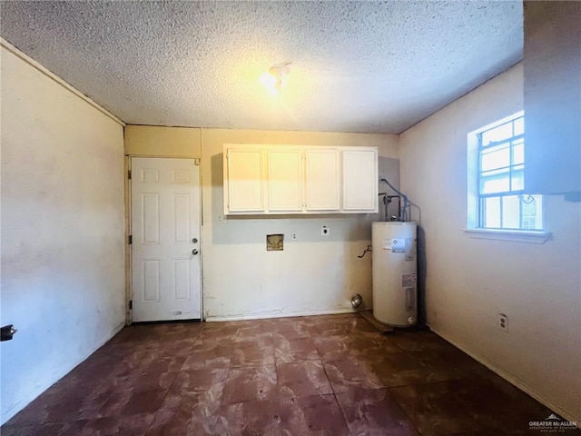 laundry area with electric dryer hookup, cabinets, a textured ceiling, and water heater