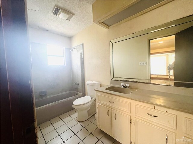 full bathroom featuring vanity, a textured ceiling, bathing tub / shower combination, tile patterned flooring, and toilet