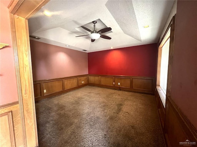 4407 Alejandro St, Mission, TX 78573 - unfurnished room featuring a raised ceiling, a textured ceiling, a ceiling fan, carpet, and a decorative wall