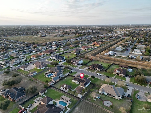 birds eye view of property with a residential view