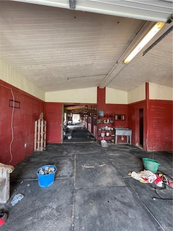 miscellaneous room with lofted ceiling