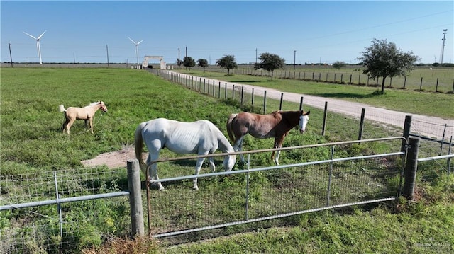 view of stable featuring a rural view