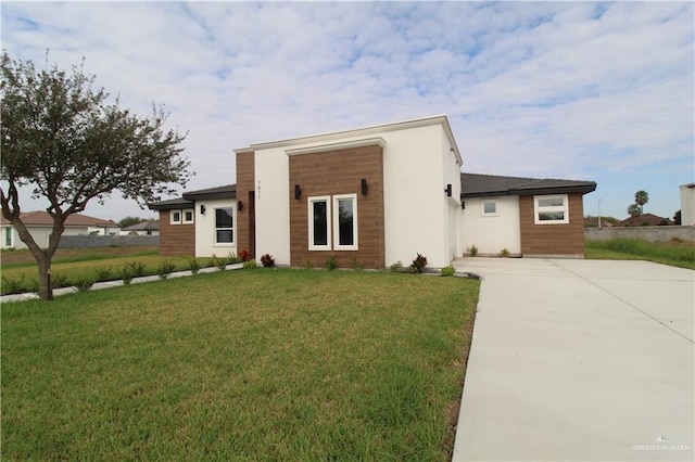 contemporary house with a front lawn