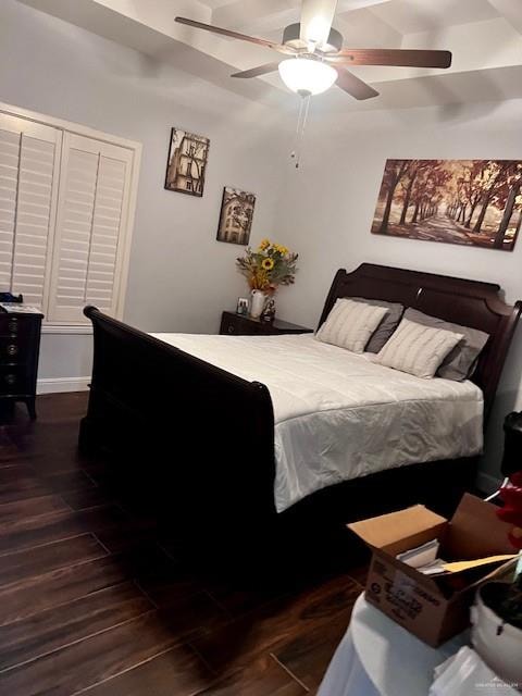 bedroom with ceiling fan and dark hardwood / wood-style floors