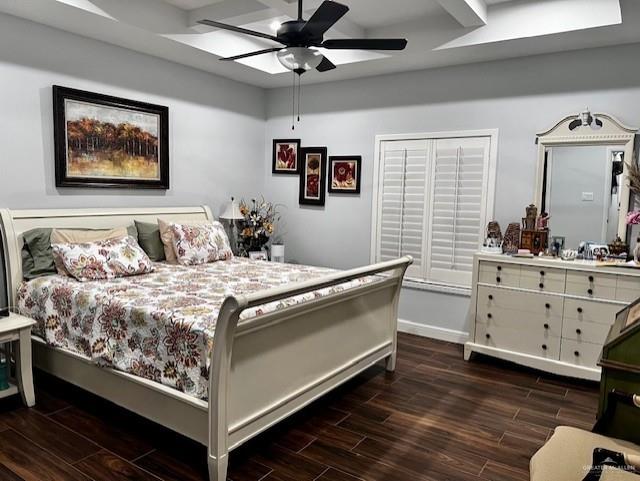 bedroom featuring ceiling fan and dark hardwood / wood-style flooring