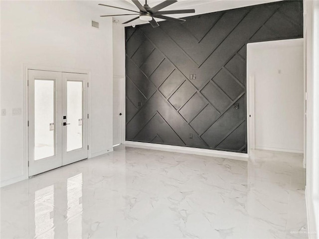 unfurnished room featuring ceiling fan and french doors