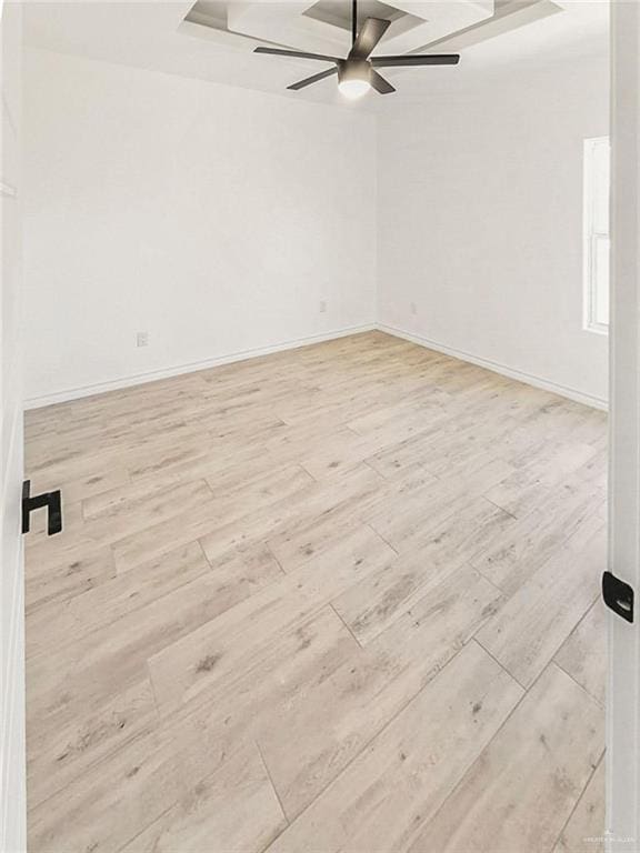 unfurnished room with ceiling fan and light wood-type flooring