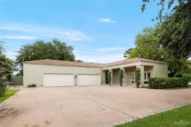 mediterranean / spanish-style house featuring a garage