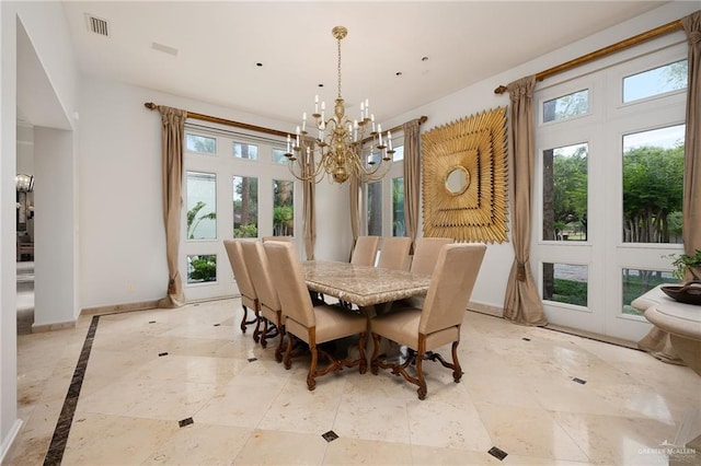 dining space featuring an inviting chandelier