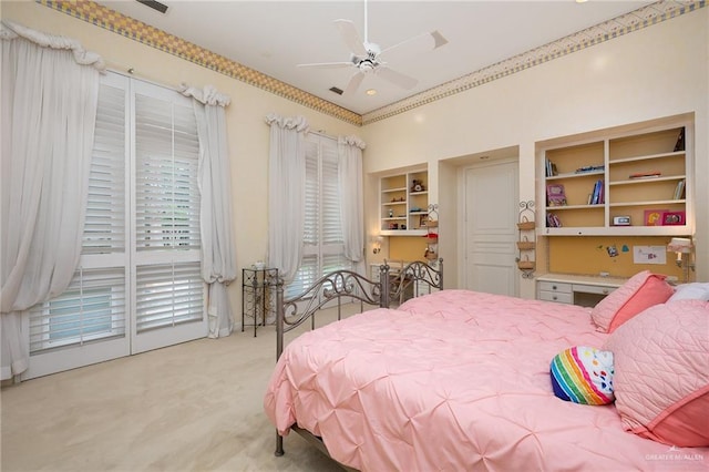 carpeted bedroom featuring access to exterior and ceiling fan