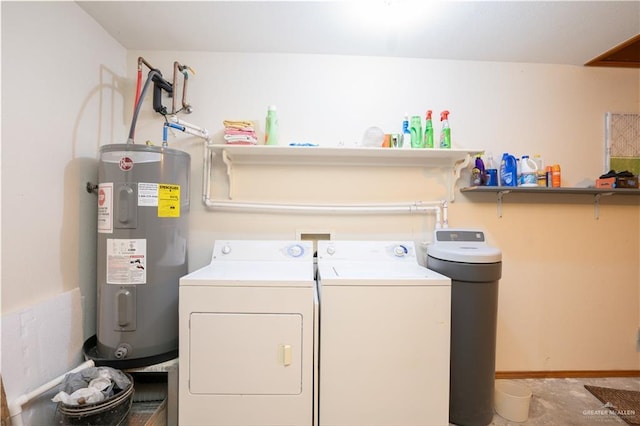 washroom featuring washer and clothes dryer and electric water heater