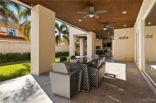 view of patio featuring ceiling fan