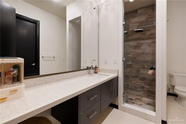 bathroom featuring vanity, an enclosed shower, and toilet