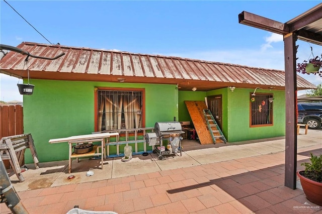 view of patio featuring a grill