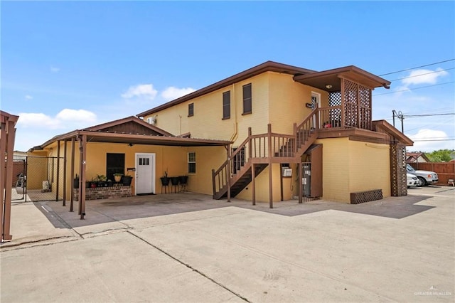 back of property with a patio area