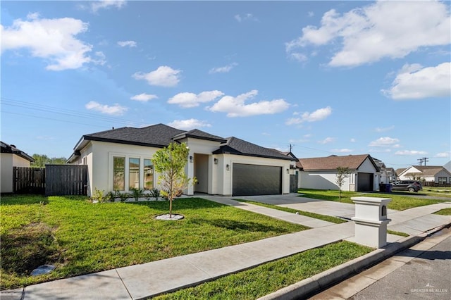 view of front of home with a front yard and a garage