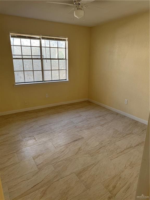 spare room featuring ceiling fan