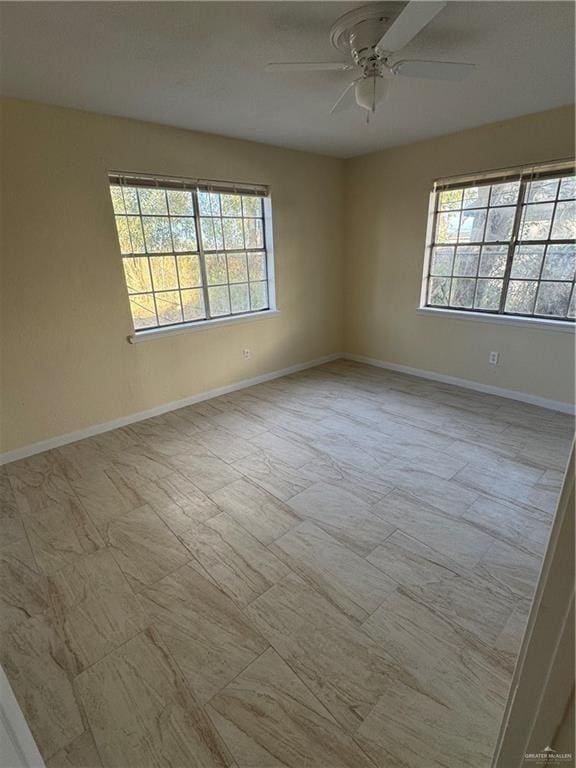 unfurnished room with ceiling fan