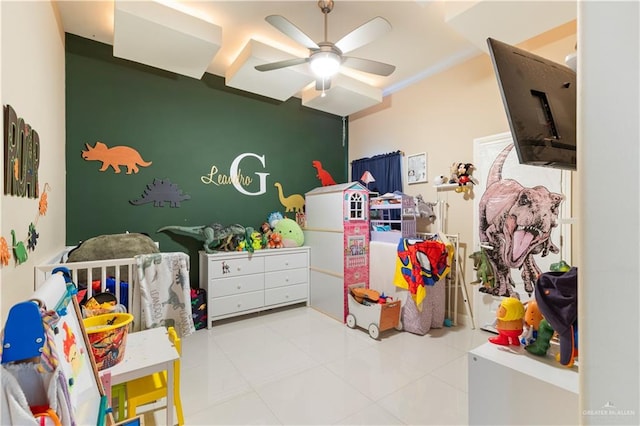 bedroom with ceiling fan and light tile patterned floors