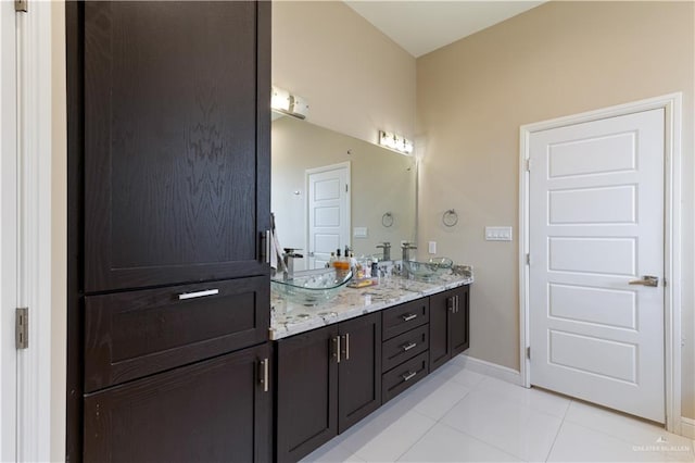 bathroom with tile patterned floors and vanity