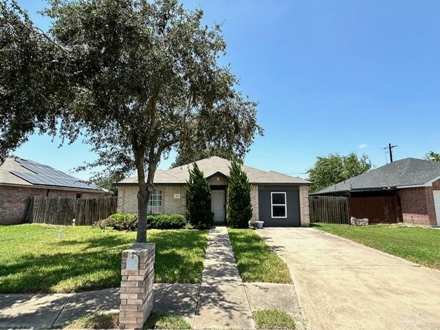 712 Bridget St, Weslaco, TX 78596 - ranch-style house with concrete driveway