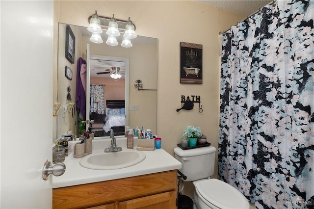 bathroom with ceiling fan, vanity, toilet, and a shower with shower curtain