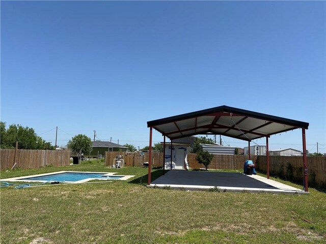 4413 Melody Ln, Edinburg, TX 78542 - exterior space with a yard, a fenced backyard, a fenced in pool, and a patio area