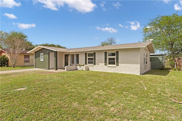 ranch-style home with a front lawn and brick siding