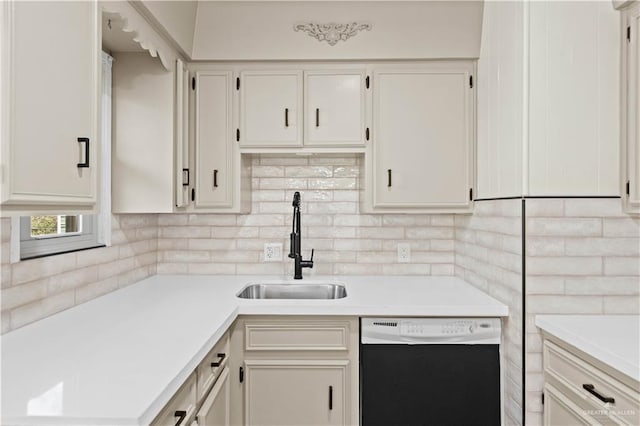 kitchen featuring a sink, white cabinets, light countertops, dishwasher, and tasteful backsplash