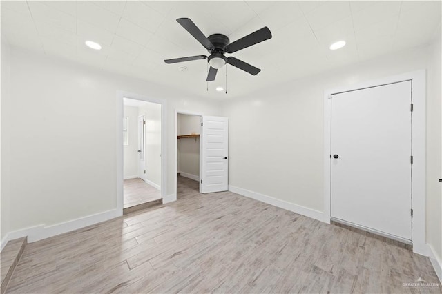 unfurnished bedroom with recessed lighting, baseboards, and light wood finished floors