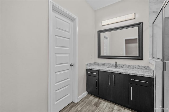 bathroom with vanity and an enclosed shower