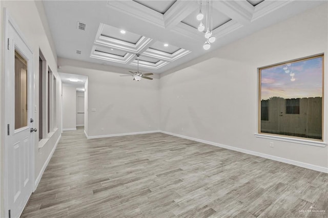 spare room featuring beamed ceiling, ceiling fan, light hardwood / wood-style floors, and coffered ceiling