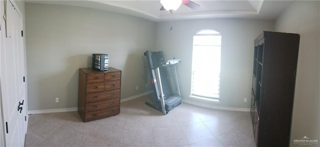 1805 Black Stone St, Edinburg, TX 78542 - bedroom with baseboards, a tray ceiling, ceiling fan, and light tile patterned flooring