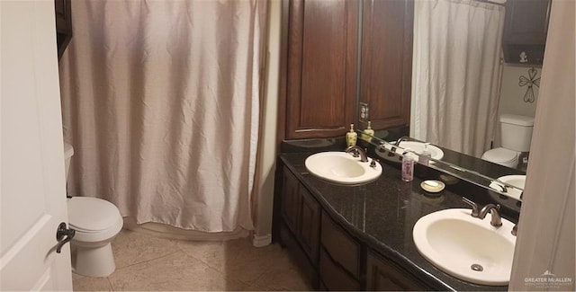 1805 Black Stone St, Edinburg, TX 78542 - bathroom with toilet, tile patterned floors, and double vanity
