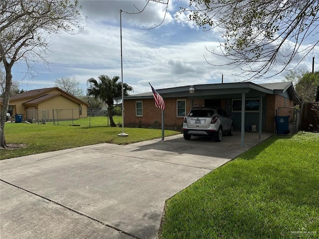 view of side of home with a lawn and a carport