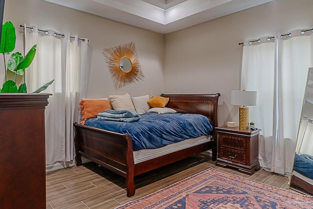 bedroom with hardwood / wood-style floors